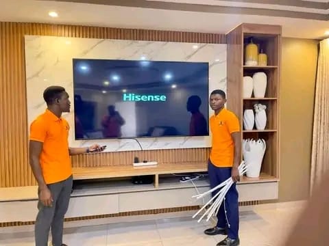 Bluetech TV Repairs technicians setting up a Hisense Smart TV